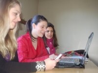 Girls learning together in front of a computer