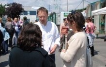 Eric Magnier being interviewed by two women